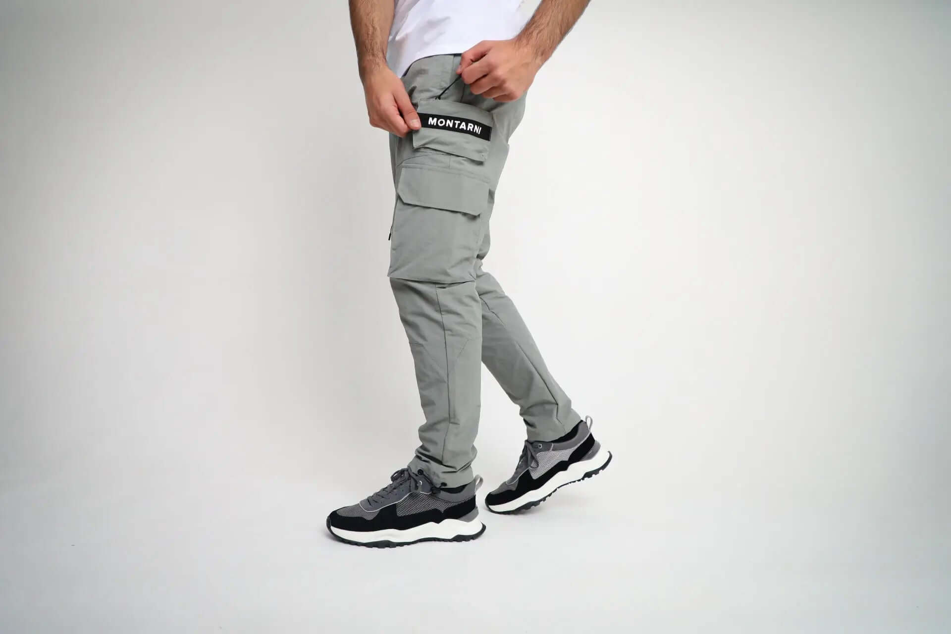 Close-up of Montarni casual Cargo pants men adjustable toggle cuffs and nylon drawstring hem in grey