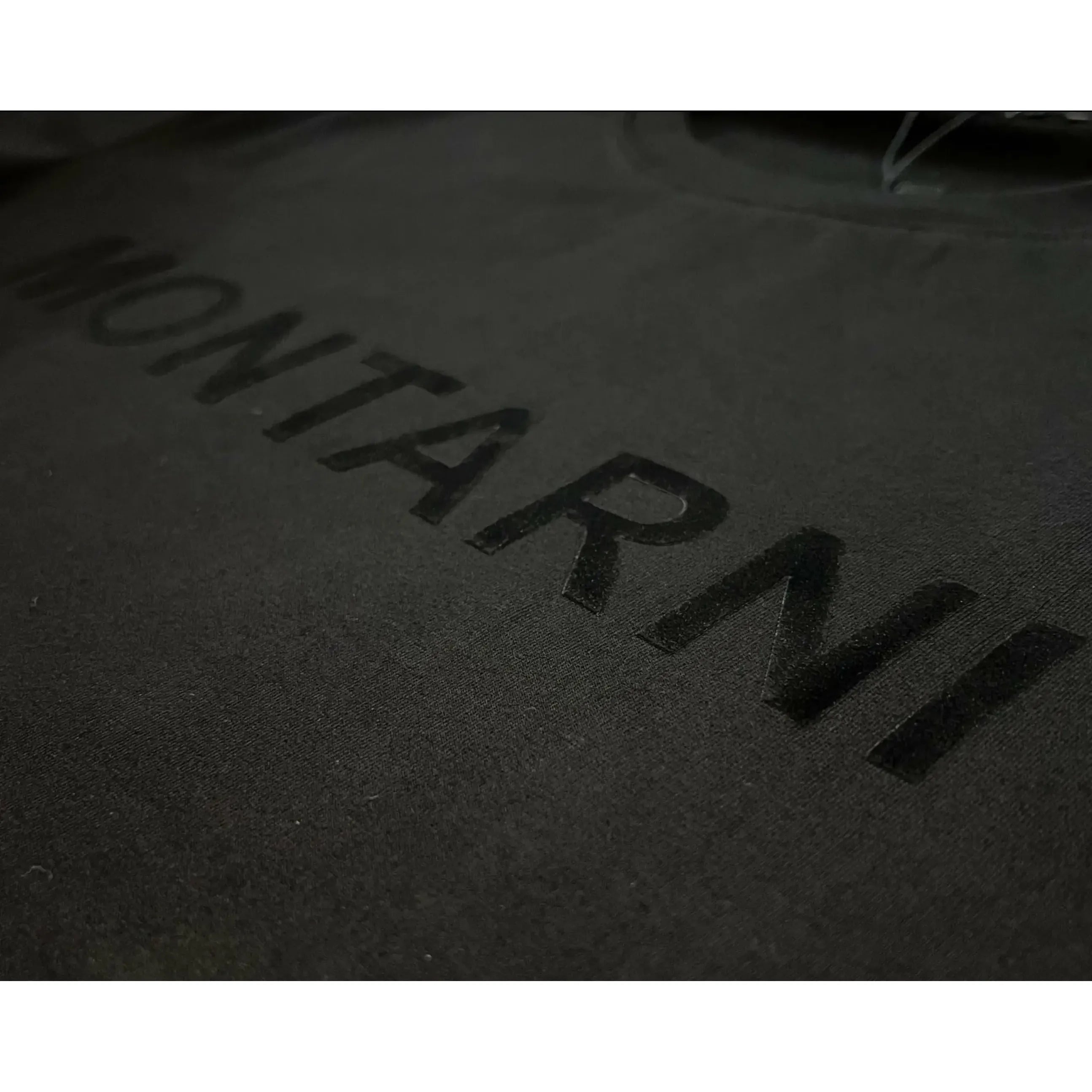 Soft cotton t-shirt featuring a flocked print design with Montarni logo in bold, sleek letters.