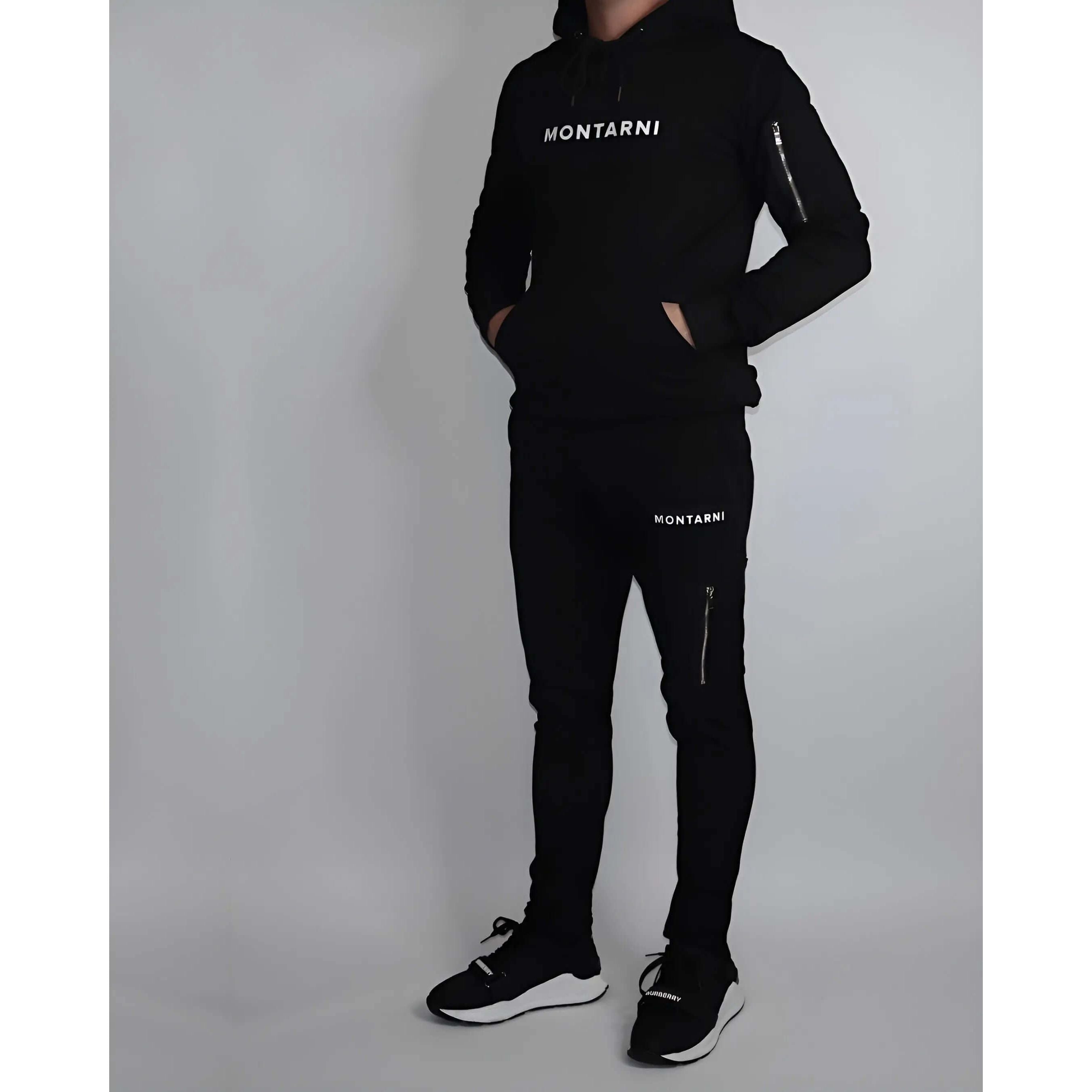 Techwear hoodie worn by a model, featuring sleek design and Montarni logo, paired with matching pants.